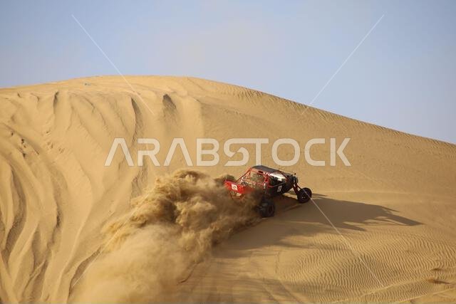 Nawan , Saudi Arabia  Jan 7 2023: 4x4 cars drift across Saudi Arabia’s striking sand desert. The vehicles perform thrilling maneuvers, on sand dunes