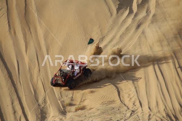 Nawan , Saudi Arabia  Jan 7 2023: 4x4 cars drift across Saudi Arabia’s striking sand desert. The vehicles perform thrilling maneuvers, on sand dunes