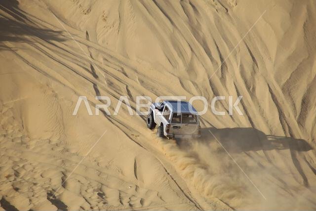 Nawan , Saudi Arabia  Jan 7 2023: 4x4 cars drift across Saudi Arabia’s striking sand desert. The vehicles perform thrilling maneuvers, on sand dunes