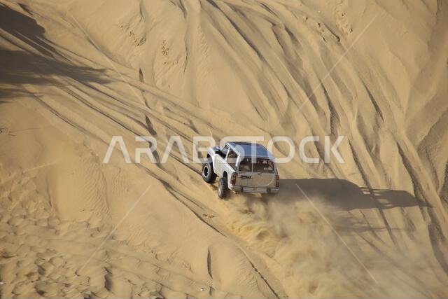 Nawan , Saudi Arabia  Jan 7 2023: 4x4 cars drift across Saudi Arabia’s striking sand desert. The vehicles perform thrilling maneuvers, on sand dunes