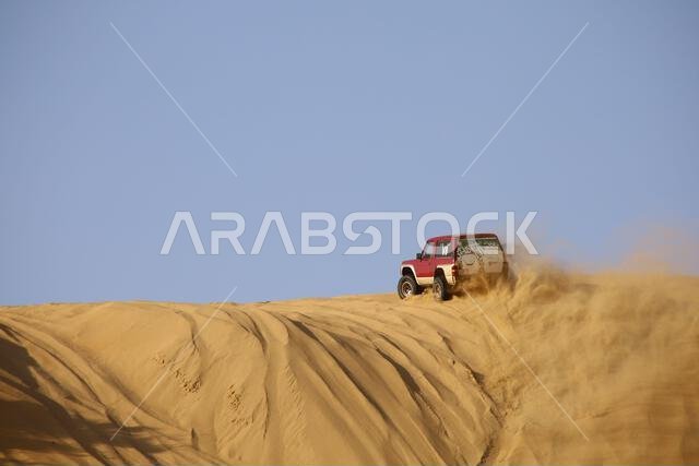 Nawan , Saudi Arabia  Jan 7 2023: 4x4 cars drift across Saudi Arabia’s striking sand desert. The vehicles perform thrilling maneuvers, on sand dunes