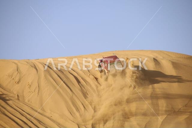 Nawan , Saudi Arabia  Jan 7 2023: 4x4 cars drift across Saudi Arabia’s striking sand desert. The vehicles perform thrilling maneuvers, on sand dunes