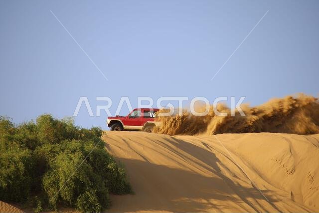 Nawan , Saudi Arabia  Jan 7 2023: 4x4 cars drift across Saudi Arabia’s striking sand desert. The vehicles perform thrilling maneuvers, on sand dunes