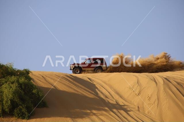 Nawan , Saudi Arabia  Jan 7 2023: 4x4 cars drift across Saudi Arabia’s striking sand desert. The vehicles perform thrilling maneuvers, on sand dunes
