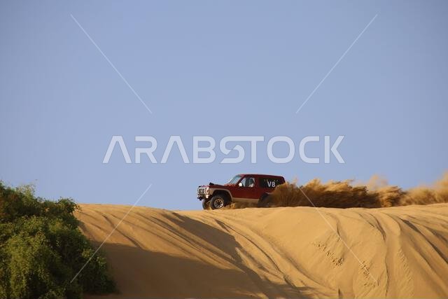 Nawan , Saudi Arabia  Jan 7 2023: 4x4 cars drift across Saudi Arabia’s striking sand desert. The vehicles perform thrilling maneuvers, on sand dunes
