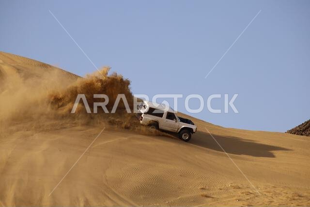 Nawan , Saudi Arabia  Jan 7 2023: 4x4 cars drift across Saudi Arabia’s striking sand desert. The vehicles perform thrilling maneuvers, on sand dunes