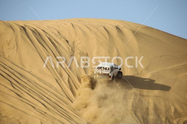 Nawan , Saudi Arabia  Jan 7 2023: 4x4 cars drift across Saudi Arabia’s striking sand desert. The vehicles perform thrilling maneuvers, on sand dunes