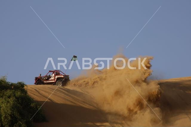 Nawan , Saudi Arabia  Jan 7 2023: 4x4 cars drift across Saudi Arabia’s striking sand desert. The vehicles perform thrilling maneuvers, on sand dunes