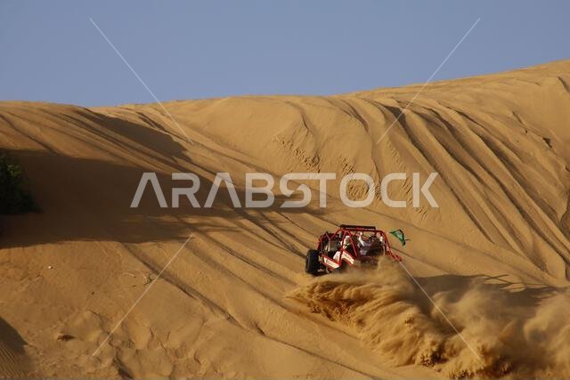 Nawan , Saudi Arabia  Jan 7 2023: 4x4 cars drift across Saudi Arabia’s striking sand desert. The vehicles perform thrilling maneuvers, on sand dunes