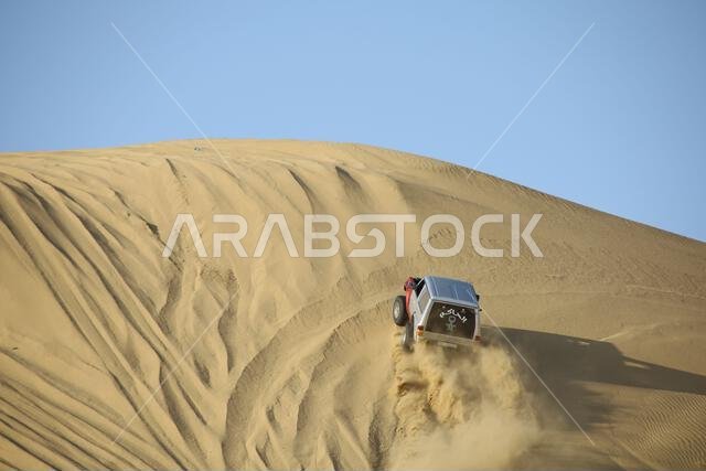Nawan , Saudi Arabia  Jan 7 2023: 4x4 cars drift across Saudi Arabia’s striking sand desert. The vehicles perform thrilling maneuvers, on sand dunes