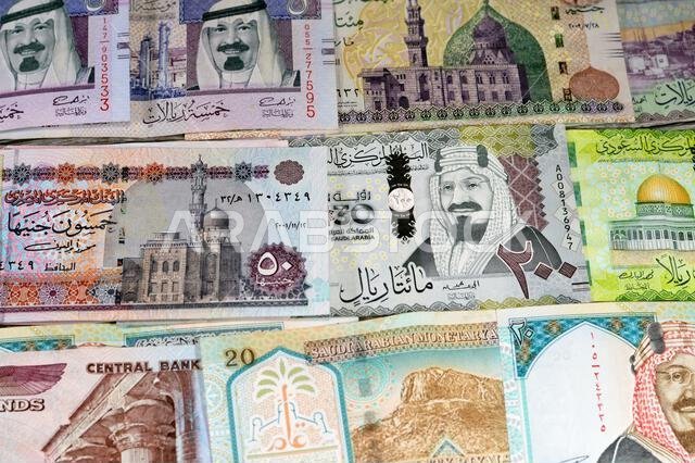 Egyptian money pounds EGP LE bills and SAR Saudi Arabia money banknotes of riyals bills, of different values, money and economic status of the currenc