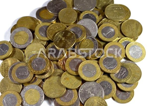 Various Saudi Arabia kingdom coins of different values and times, Old and new Saudi Riyals currency of 2 riyals, 1 riyal, half and quarter of a riyal