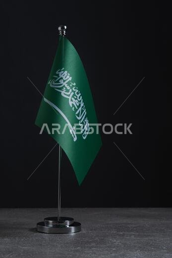 Saudi Arabia Flag on Metal Flagpole Isolated on Black Background