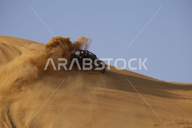 Nawan , Saudi Arabia  Jan 7 2023: 4x4 cars drift across Saudi Arabia’s striking sand desert. The vehicles perform thrilling maneuvers, on sand dunes