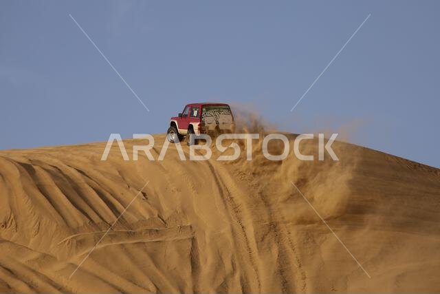 Nawan , Saudi Arabia  Jan 7 2023: 4x4 cars drift across Saudi Arabia’s striking sand desert. The vehicles perform thrilling maneuvers, on sand dunes