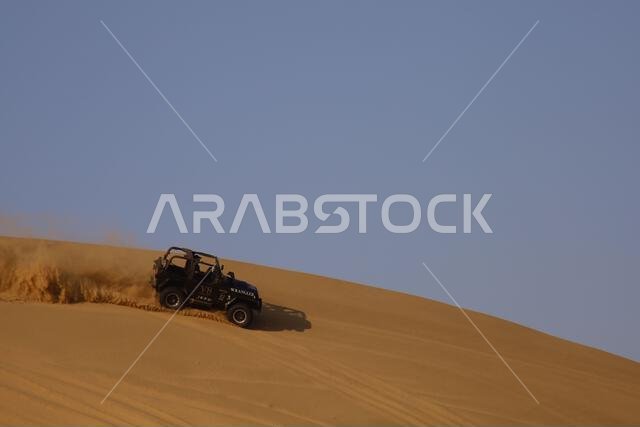 Nawan , Saudi Arabia  Jan 7 2023: 4x4 cars drift across Saudi Arabia’s striking sand desert. The vehicles perform thrilling maneuvers, on sand dunes