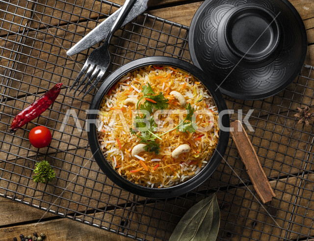 A plate of delicious biryani rice, dazzling rice, traditional Arab food, Arab food, popular dishes, healthy and useful dish, delicious recipes and food dishes, healthy delicious meals, oriental restaurants, restaurants for oriental Arab food