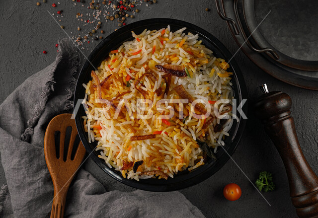 A plate of delicious biryani rice, dazzling rice, traditional Arab food, Arab food, popular dishes, healthy and useful dish, delicious recipes and food dishes, healthy delicious meals, oriental restaurants, restaurants for oriental Arab food