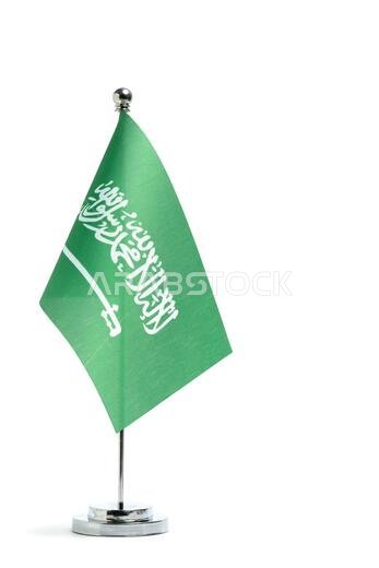 Table flag Saudi Arabia on metal flagpole, highlighted on white background