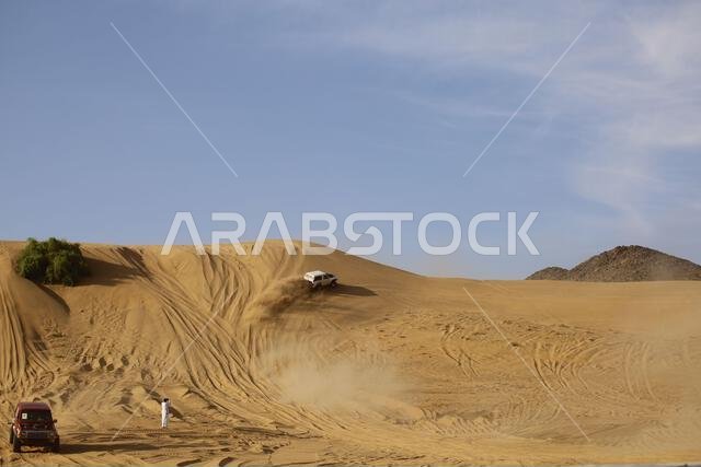 Nawan , Saudi Arabia  Jan 7 2023: 4x4 cars drift across Saudi Arabia’s striking sand desert. The vehicles perform thrilling maneuvers, on sand dunes