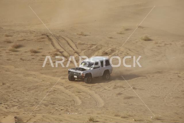 Nawan , Saudi Arabia  Jan 7 2023: 4x4 cars drift across Saudi Arabia’s striking sand desert. The vehicles perform thrilling maneuvers, on sand dunes