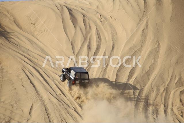 Nawan , Saudi Arabia  Jan 7 2023: 4x4 cars drift across Saudi Arabia’s striking sand desert. The vehicles perform thrilling maneuvers, on sand dunes