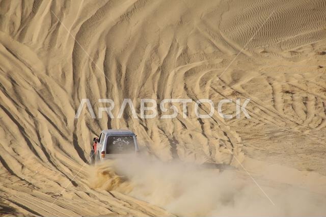 Nawan , Saudi Arabia  Jan 7 2023: 4x4 cars drift across Saudi Arabia’s striking sand desert. The vehicles perform thrilling maneuvers, on sand dunes