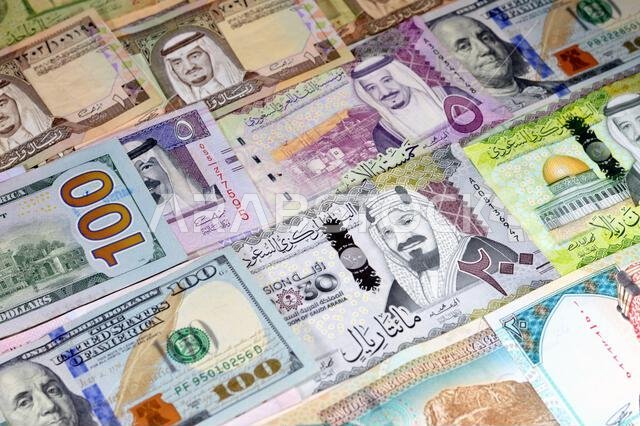 American money dollars banknotes USD and SAR Saudi Arabia money banknotes of riyals bills, of different values, money and economic status of the curre
