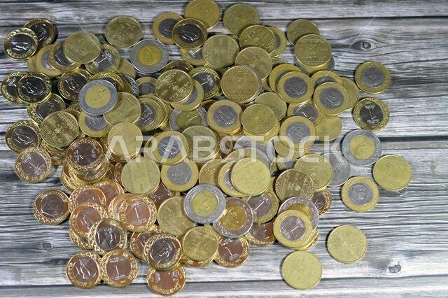 Various Saudi Arabia kingdom coins of different values and times, Old and new Saudi Riyals currency of 2 riyals, 1 riyal, half and quarter of a riyal