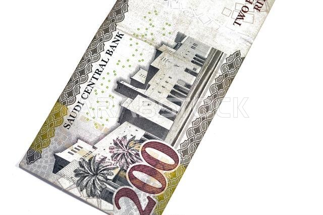 Reverse side of 200 SAR two hundred Saudi Arabian riyals banknote, features Qasr Al Hukm in Riyadh City with the bank name above the image and the den
