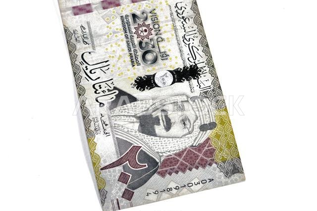 the obverse side of 200 SAR two hundred Saudi Arabian riyals banknote, features King Abdul Aziz Al Saud and Saudi kingdom vision of year 2030, issued