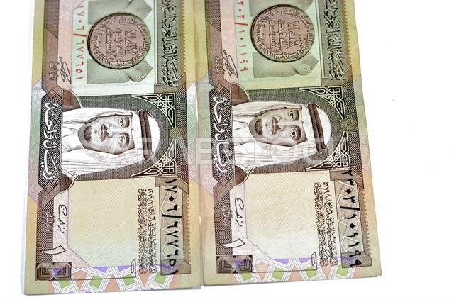 The obverse side of an old Saudi Arabia banknote bill, one 1 Riyal SAR features Fahd bin Abdulaziz Al Saud, Custodian of the Two Holy Mosques and the