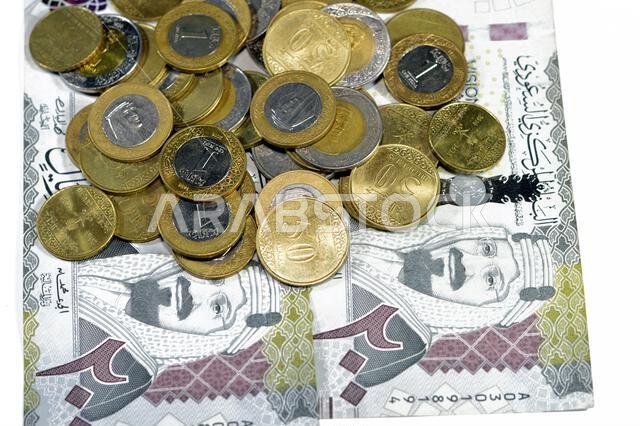 200 SAR two hundred Saudi Arabian riyals banknote, features King Abdul Aziz Al Saud and Saudi kingdom vision of year 2030 with Saudi coins of 2 riyals