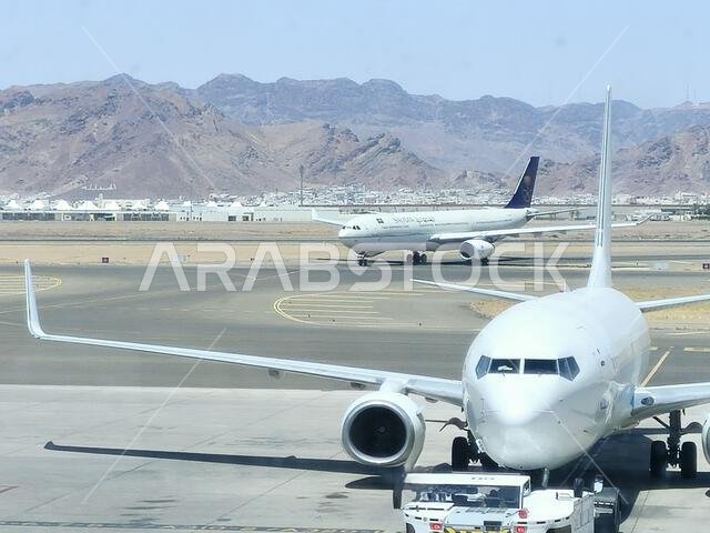Medina, Saudi Arabia, June 29 2024: Saudi Airlines plane in Prince Mohammad Bin AbdulAziz International Airport, in Madinah, handles domestic and regi