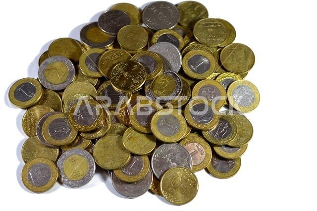 Various Saudi Arabia kingdom coins of different values and times, Old and new Saudi Riyals currency of 2 riyals, 1 riyal, half and quarter of a riyal