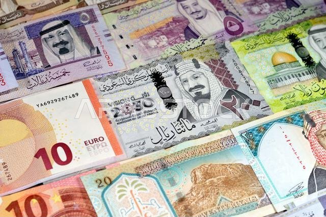 European money Euros banknotes EUR and SAR Saudi Arabia money banknotes of riyals bills, of different values, money and economic status of the currenc European money Euros banknotes EUR and SAR Saudi Arabia money banknotes of riyals bills, of different values, money and economic status of the currenc