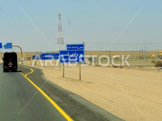 Makkah Madinah road, Saudi Arabia, June 25 2024: Wadi Gudaid side road sign at Mecca Medina highway road, Tourism and pilgrimage concept in kingdom of