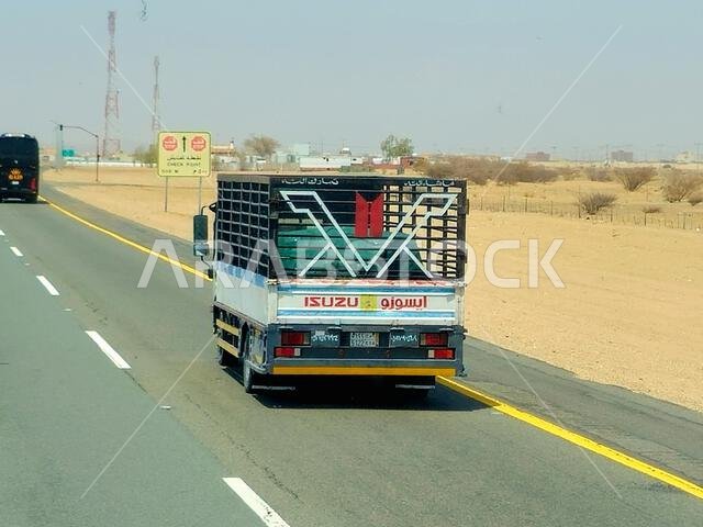Makkah Madinah road, Saudi Arabia, June 25 2024: Isuzu transportation truck on the road for logistics and transportations, Isuzu is a Japanese multina