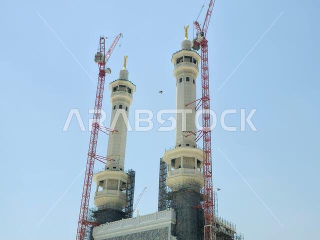 Mecca, Saudi Arabia, June 4 2024: Minarets of Al Masjid Al Haram mosque around the Kaaba in Hajj, pilgrimage, Umrah, with crane towers around it for m Mecca, Saudi Arabia, June 4 2024: Minarets of Al Masjid Al Haram mosque around the Kaaba in Hajj, pilgrimage, Umrah, with crane towers around it for m