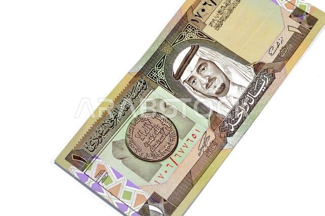 The obverse side of an old Saudi Arabia banknote bill, one 1 Riyal SAR features Fahd bin Abdulaziz Al Saud, Custodian of the Two Holy Mosques and the