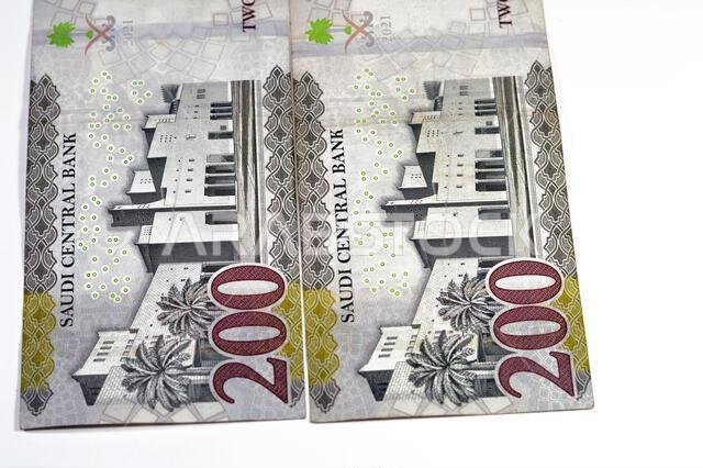 Reverse side of 200 SAR two hundred Saudi Arabian riyals banknote, features Qasr Al Hukm in Riyadh City with the bank name above the image and the den