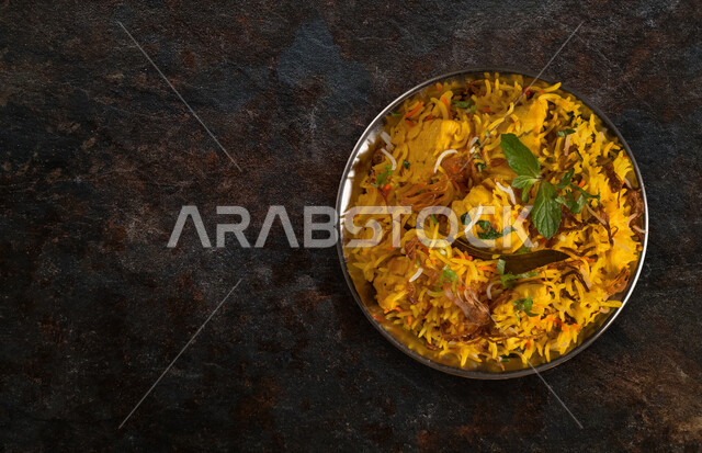 A plate of delicious biryani rice with meat, dazzling rice, traditional Arab dishes, Arab food, traditional dishes, delicious recipes and food dishes, delicious healthy meals, oriental restaurants, restaurants for oriental Arab food