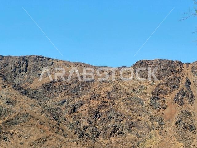 Mount Uhud, a mountain north of Medina, the site of the second battle between the Islamic prophet Muhammad and the polytheists of his tribe of Quraysh Mount Uhud, a mountain north of Medina, the site of the second battle between the Islamic prophet Muhammad and the polytheists of his tribe of Quraysh