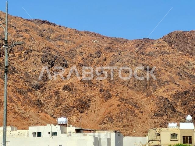 Mount Uhud, a mountain north of Medina, the site of the second battle between the Islamic prophet Muhammad and the polytheists of his tribe of Quraysh