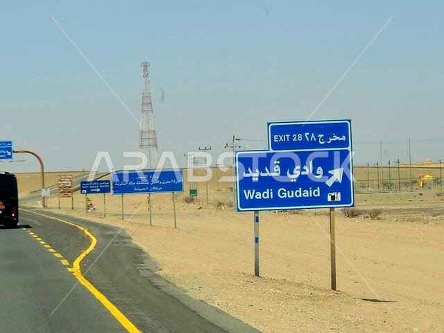 Makkah Madinah road, Saudi Arabia, June 25 2024: Wadi Gudaid side road sign at Mecca Medina highway road, Tourism and pilgrimage concept in kingdom of Makkah Madinah road, Saudi Arabia, June 25 2024: Wadi Gudaid side road sign at Mecca Medina highway road, Tourism and pilgrimage concept in kingdom of