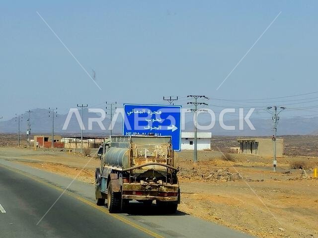 Makkah Madinah road, Saudi Arabia, June 25 2024: Tanker truck with a container tank with liquid products, a lorry on the highway with a container on i Makkah Madinah road, Saudi Arabia, June 25 2024: Tanker truck with a container tank with liquid products, a lorry on the highway with a container on i