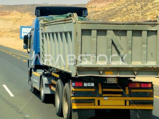 Makkah Madinah road, Saudi Arabia, June 25 2024: A transportation truck on the road for logistics and transportations of materials, for industrial and Makkah Madinah road, Saudi Arabia, June 25 2024: A transportation truck on the road for logistics and transportations of materials, for industrial and