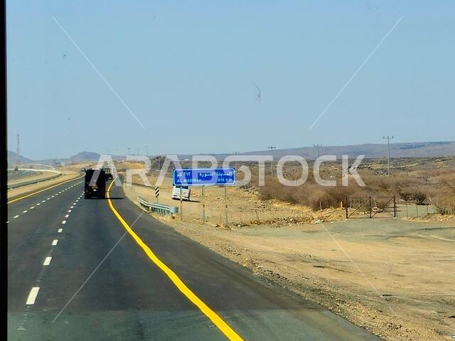 Makkah Madinah road, Saudi Arabia, June 25 2024: Al Madinah Medina city signboard, 212 Kilometers ahead, at Mecca Medina highway road, Tourism and pil Makkah Madinah road, Saudi Arabia, June 25 2024: Al Madinah Medina city signboard, 212 Kilometers ahead, at Mecca Medina highway road, Tourism and pil
