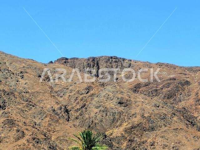 Mount Uhud, a mountain north of Medina, the site of the second battle between the Islamic prophet Muhammad and the polytheists of his tribe of Quraysh