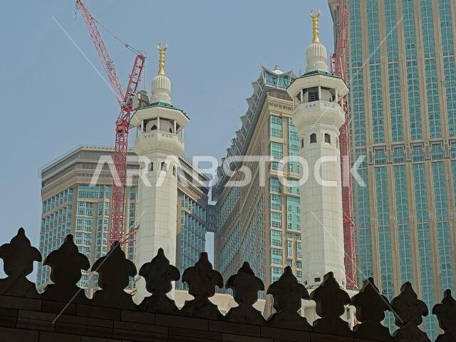 Mecca, Saudi Arabia, June 4 2024: Minarets of Al Masjid Al Haram mosque around the Kaaba in Hajj, pilgrimage, Umrah, with crane towers around it for m